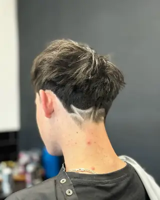 Taper fade with a shaved neck design